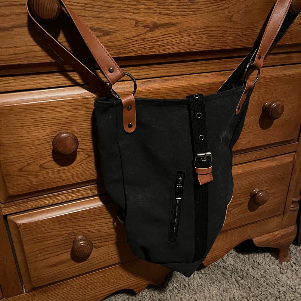 Canvas, backpacks in 2 colors. Black and brown. New with no tags. $8 each.